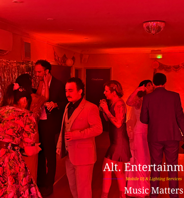 Wedding guests dancing during an evening reception at Sutton Coldfield Golf Club in Sutton Coldfield, West Midlands, with professional DJ entertainment provided by Alt. Entertainments Wedding DJ services.