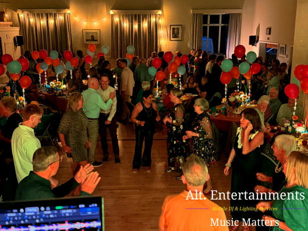 Guests dancing and celebrating at a birthday party at Woodhouse Eaves Village Hall in Leicestershire, with music, lighting, and DJ entertainment provided by Alt. Entertainments Mobile DJ services.