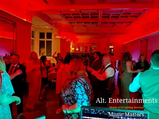 Guests joyfully dance at a wedding celebration at Pendrell Hall, Codsall Wood, Staffordshire. Alt. Entertainments provides Wedding DJ, Mobile DJ, Indie DJ, Disco, and Event Services, creating a magical atmosphere for the festivities.