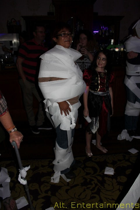 Vibrant Mummy Competition at Wychnor Park Country Club, Barton-Under-Needwood, Staffordshire, captured by Alt. Entertainments (Mobile DJ, Disco & Events). Participants wrap themselves in bandages in a fun-filled contest.