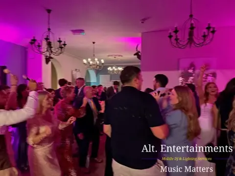 Wedding guests dancing and celebrating on the dance floor at St. John’s House, Lichfield, Staffordshire, with music by Alt. Entertainments Wedding DJ & Mobile DJ.