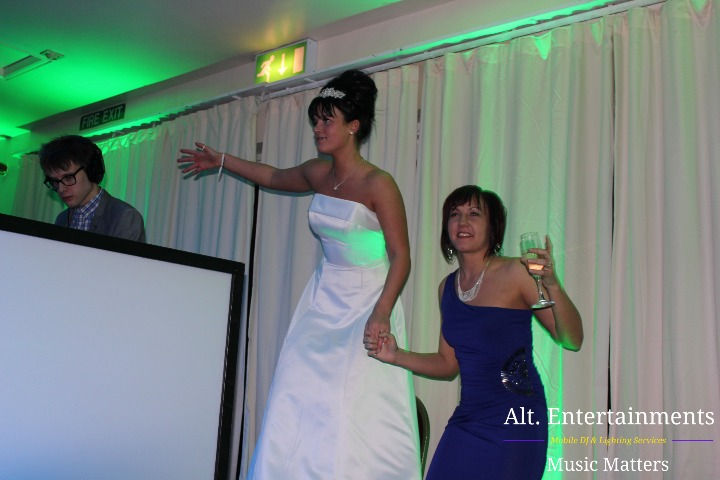 Alt. Entertainments captures the bride's radiant elegance at Cannock Hockey & Cricket Club, Staffordshire. With her captivating pose and charming smile, she embodies the essence of timeless beauty on her special day.