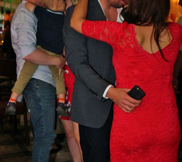 A lively wedding celebration at Beau Desert Golf Club in Cannock, Staffordshire, as guests dance joyfully with the bride amidst the picturesque green landscape, capturing the essence of love and happiness on this special day.