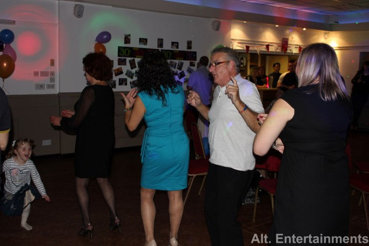 Energetic dancers performing at Michelin Athletics Club in Stoke-on-Trent, Staffordshire, captured by Alt. Entertainments, a Mobile DJ, Disco & Events company.