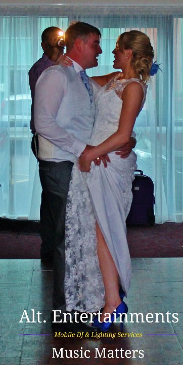 A bride and groom share their first dance at PDL Ramada (Now Holiday Inn) in Cannock, Staffordshire, captured by Altentertainments, a Mobile DJ, Disco & Events Company, showcasing the romance and elegance of the moment.