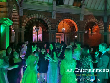 Guests dancing energetically at a wedding reception in the Carriage Court at the Renaissance at Kelham Hall, Newark, Nottinghamshire. The photo, taken by Alt. Entertainments, shows the lively atmosphere of the event created by their Wedding DJ/Mobile DJ, disco & events company.