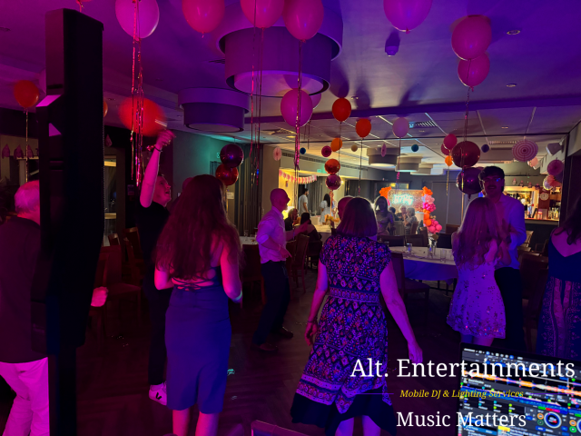 Guests dancing and celebrating during a birthday party at Copt Heath Golf Club in Knowle, Solihull, Warwickshire, with professional entertainment provided by Alt. Entertainments Wedding DJ, Mobile DJ, and Events Entertainment services.