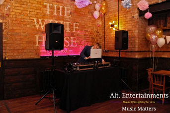 A sophisticated DJ setup by Alt. Entertainments at The White Horse in Quorn, Leicestershire, featuring high-quality RCF speakers and a professional DJ console. The setup includes subtle lighting effects, providing exceptional sound quality and a sleek appearance for any event.