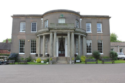 A breathtaking view of Brocton Hall Golf Club in Staffordshire, captured by Alt. Entertainments, a distinguished mobile DJ, Disco & Events company. The image showcases the manicured greens and elegant architecture of the club, embodying its charm as a premier venue for leisure and celebrations.