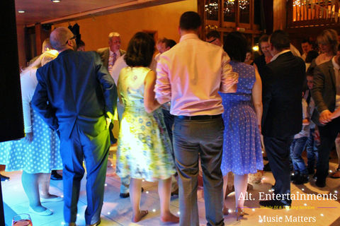 A jubilant crowd fills the dance floor, moving to the music at a wedding disco held at Hundred House in Telford/Bridgnorth, Shropshire. Captured by Alt. Entertainments Wedding DJ/Mobile DJ, Disco & Events.