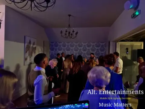 Guests dancing and celebrating at a wedding party inside St. John’s House, Lichfield, Staffordshire, with entertainment provided by Alt. Entertainments Wedding DJ and Mobile DJ.