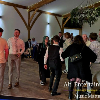 Colorful dancers performing at Coton House Farm wedding in Whittington, Lichfield, Staffordshire, captured by Alt. Entertainments Mobile DJ, Disco & Events Company.