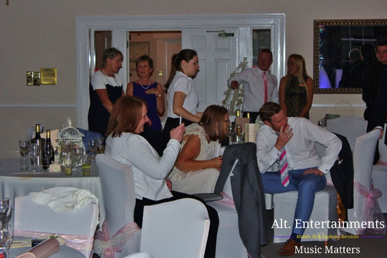 Guests dance joyfully at a wedding celebration in Brocton Hall, Staffordshire, skillfully photographed by Alt. Entertainments, specialists in Mobile DJ, Disco & Events.
