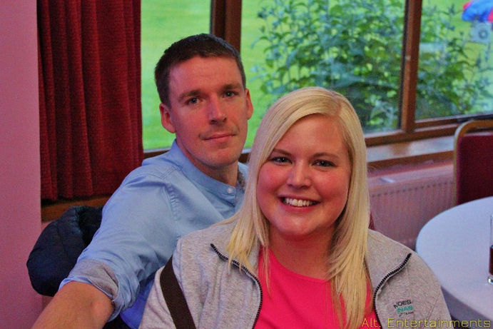 A vibrant crowd dancing at a party held at Crewe Vagrants Sports Club in Nantwich, Cheshire. The photo, taken by Alt. Entertainments, features guests enjoying the event under colorful lighting, demonstrating the mobile DJ and events company's ability to create a lively and engaging atmosphere.