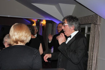 Energetic dancers groove to the music at Bicester Hotel Golf & Spa in Oxfordshire, captured by Alt. Entertainments, a mobile DJ, Disco & Events Company. The dynamic lighting adds to the ambiance, creating a mesmerizing atmosphere of celebration. #DanceDelight #GrooveZone #EventEntertainment