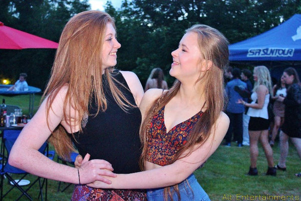 A joyful crowd celebrates at an 18th birthday party in Yoxall, Staffordshire, with entertainment provided by Alt. Entertainments, a Mobile DJ, Disco & Events Company.