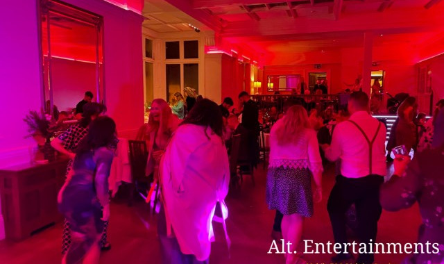 A lively group of people dancing joyfully at a wedding reception in Pendrell Hall, located in Codsall Wood, Staffordshire. The moment captured by Alt. Entertainments, specialists in Wedding DJ/Mobile DJ, Disco & Event Services.