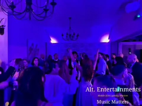 Bride and groom sharing their first dance at a wedding reception at St. John’s House in Lichfield, Staffordshire, with music provided by Alt. Entertainments Wedding DJ and Mobile DJ company.