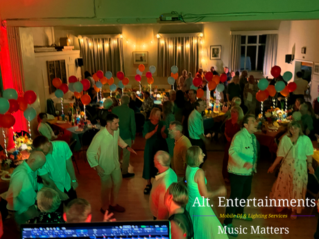 People dancing at a birthday party at Woodhouse Eaves Village Hall in Leicestershire, enjoying music and lighting provided by Alt. Entertainments Mobile DJ services.