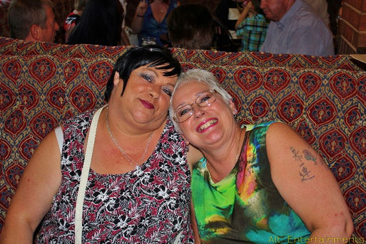 A cheerful crowd enjoys a birthday party at Pelsall Social Club (The Scratter) in Walsall, West Midlands, photographed by Alt. Entertainments, a reputable mobile DJ, disco & events company, showcasing the vibrant energy of the event.