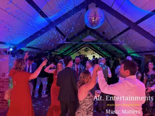 Guests dancing at a wedding reception at Grangefields Barn in Ashbourne, Derbyshire, with music and entertainment by Alt. Entertainments wedding DJ and mobile DJ.