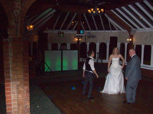 A vibrant mobile DJ setup at Ardencote Manor Hotel in Warwickshire, captured by Alt. Entertainments, a Mobile DJ, Disco & Events Company. The setup includes colorful lights and professional equipment, perfect for weddings, corporate events, and parties.