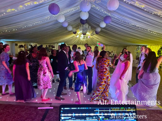 Wedding guests enjoying a lively dance at Stanbrook Abbey.