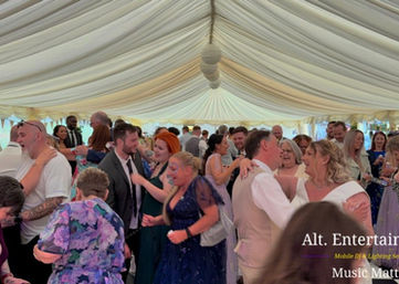 Bride and groom sharing their magical first dance at Springslade Lodge, Cannock Chase, Staffordshire, with professional music, lighting, and entertainment provided by Alt. Entertainments, a wedding DJ and mobile events company.
