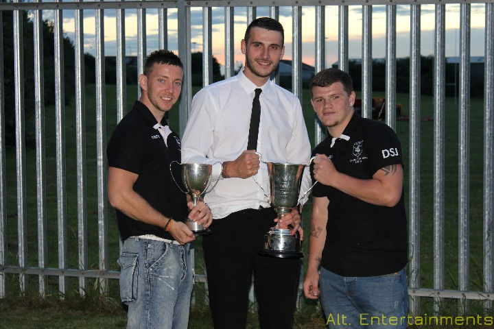 A group of people posing for a photo at Coney Hill RFC in Gloucester, Gloucestershire, captured by Alt. Entertainments Mobile DJ Disco & Events Company. Laughter and smiles fill the frame as attendees strike poses, embodying the joyous spirit of community gatherings.