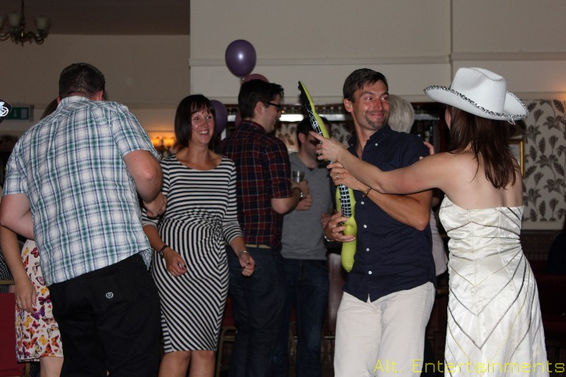 Vibrant dancers showcase their moves at a lively birthday party hosted at Bucknall Bowling & Recreation Club in Stoke-On-Trent, Staffordshire, captured by Alt. Entertainments, experts in Mobile DJ, Disco & Events.