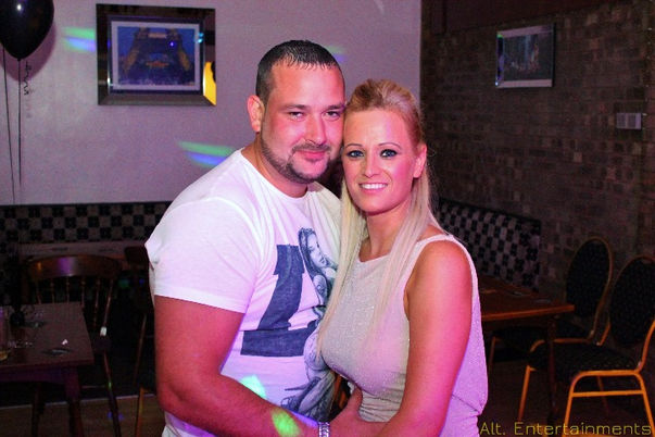 A lively crowd gathers at Studley Cricket Club in Redditch, Worcestershire, to celebrate a birthday party in grand style. Captured by Alt. Entertainments, a mobile DJ, disco, and events provider, the scene is alive with colorful decorations and infectious joy.