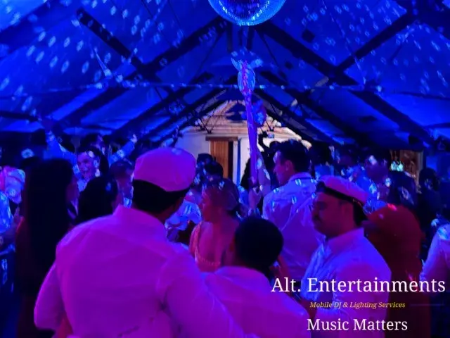 Wedding guests dancing at Grangefields Barn, Ashbourne, Derbyshire, with professional wedding DJ and mobile event services provided by Alt. Entertainments.