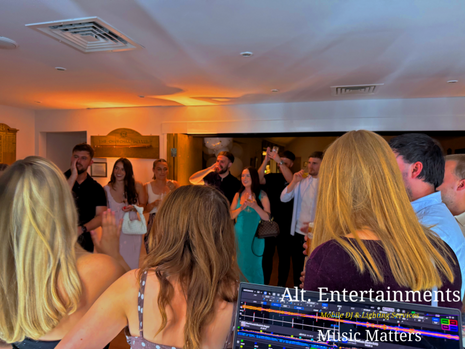 Guests dancing and celebrating during a 30th birthday party at Churchill & Blakedown Golf Club near Kidderminster, Worcestershire, with professional mobile DJ entertainment provided by Alt. Entertainments.