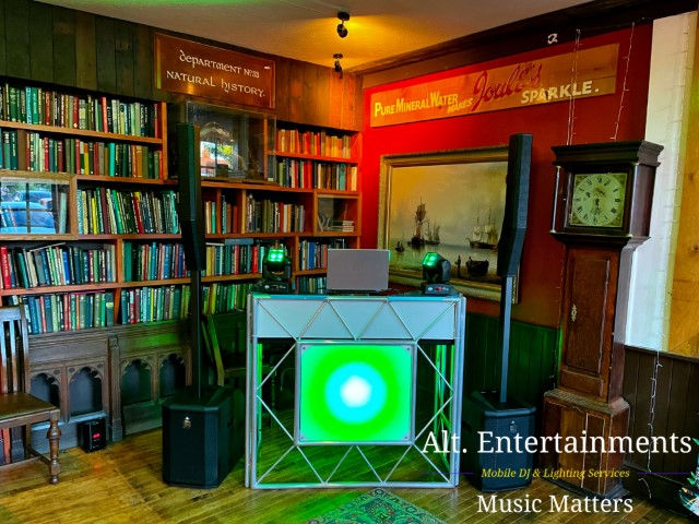 Alt. Entertainments' mobile DJ setup at The Crown Joules in Codsall, Wolverhampton, fills the venue with vibrant energy. Colorful lights and professional equipment set the stage for an unforgettable event.