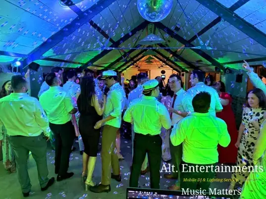 Wedding guests dancing and celebrating at Grangefields Barn, Ashbourne, Derbyshire, with professional DJ and event services provided by Alt. Entertainments, a Wedding DJ and Mobile DJ Company.