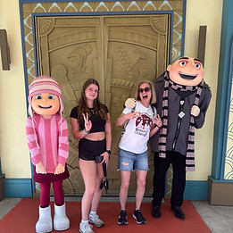 Amy Brown and her daughter posing with Gru and Edith at Universal Studios Florida
