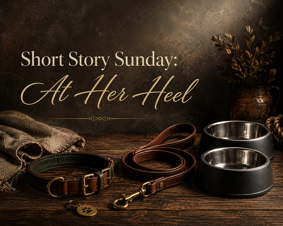 A moody rustic still life featuring a brown leather dog collar and leash, two metal dog bowls, a folded neutral blanket, and a paw-print tag beneath the title “Short Story Sunday: At Her Heel.”