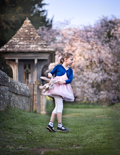 girl dancing in front of cherry blossoms
