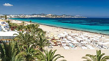 Playa d'en Bossa Beach with sun beds in Ibiza