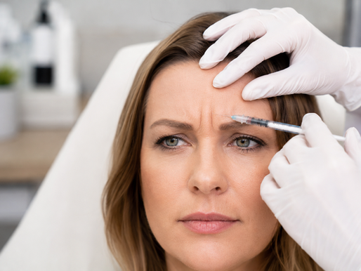 Woman receiving BOTOX for Frown Lines in Langley with visible forehead creases