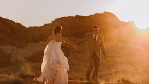 bride and groom holding hands in desert by oak rose photography