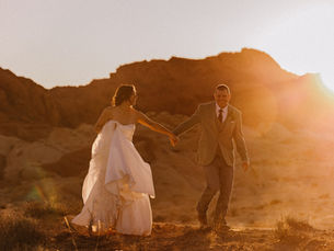 bride and groom holding hands in desert by oak rose photography