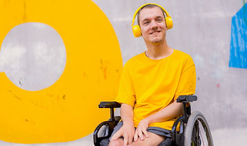 disabled-person-in-wheelchair-listening-to-music-2023-11-27-05-29-16-utc.jpg