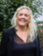 betsy in black jacket headshot .jpg