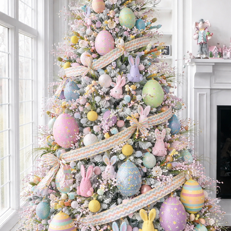 Pastel Easter tree decor with oversized egg ornaments, woven ribbon, floral picks, and bunny decorations