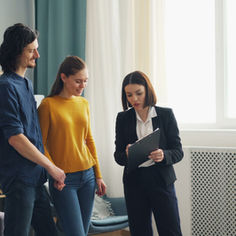 Siblings discussing with a female agent.