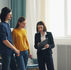Siblings discussing with a female agent.