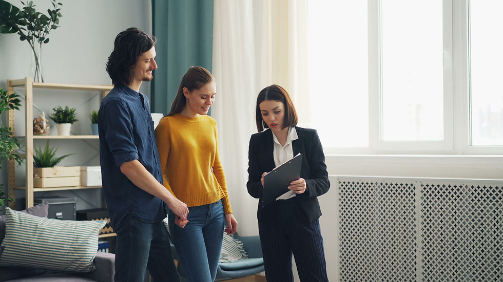 Siblings discussing with a female agent.