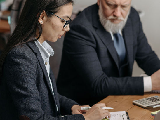 A female agent in a discussion with a high net worth individual client.