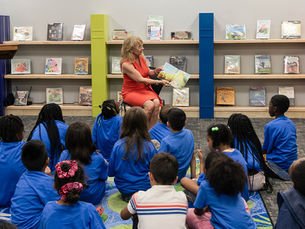 Indiana's First Lady reading a book to a group of children.